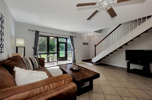 living room featuring light tile patterned floors, french doors, and ceiling fan