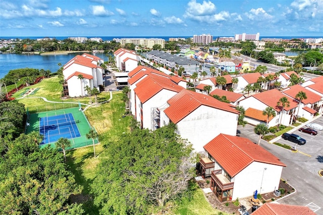 birds eye view of property with a water view