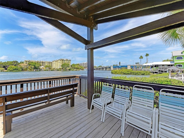 wooden deck featuring a water view