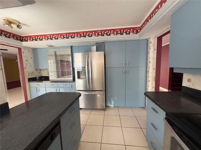 kitchen with crown molding, appliances with stainless steel finishes, and light tile patterned floors