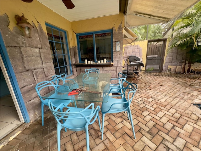 view of patio featuring ceiling fan