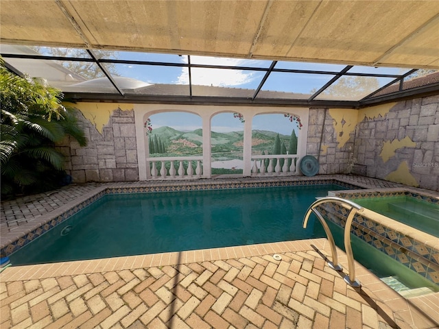 view of pool with an in ground hot tub, a lanai, a mountain view, and a patio area