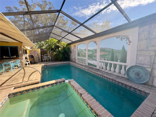 view of swimming pool with a mountain view, a patio, glass enclosure, and exterior bar