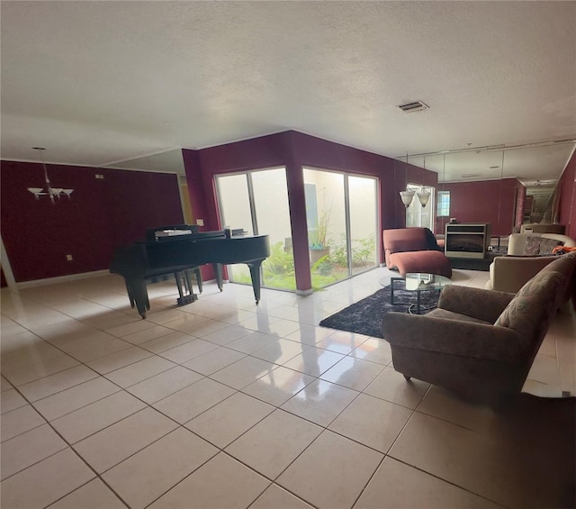 living room with light tile patterned floors and a textured ceiling