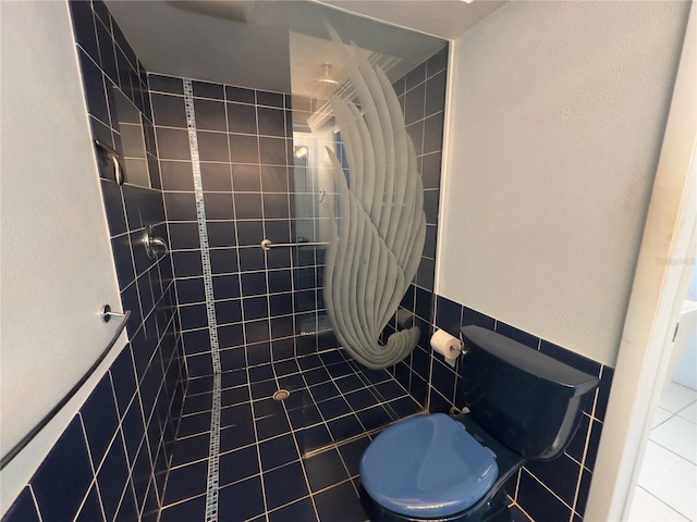 bathroom featuring tile patterned floors and toilet