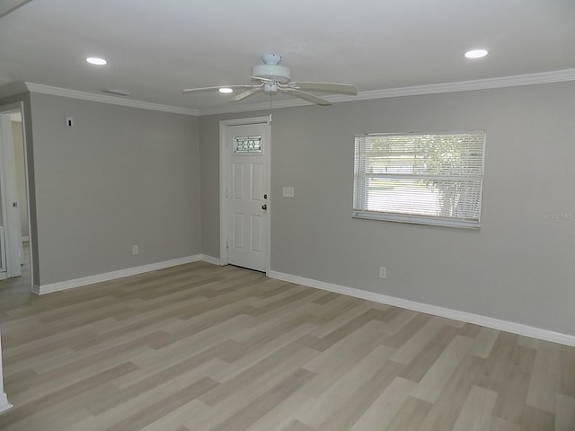 foyer with light hardwood / wood-style floors, ceiling fan, and ornamental molding