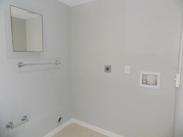 laundry area with hookup for a washing machine, light tile patterned floors, hookup for a gas dryer, and electric dryer hookup