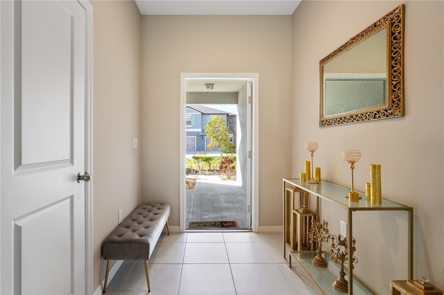 doorway to outside featuring light tile patterned flooring