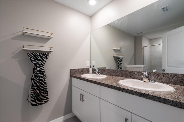 bathroom with vanity and an enclosed shower