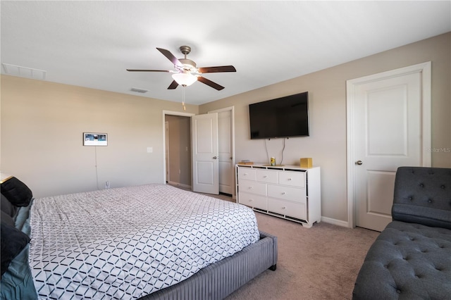 carpeted bedroom with ceiling fan