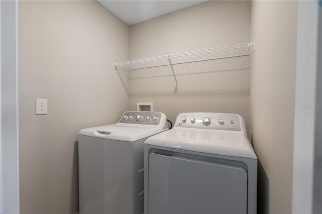 laundry room with washing machine and dryer