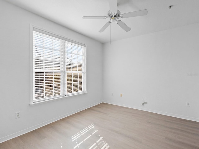 unfurnished room with light hardwood / wood-style flooring and ceiling fan