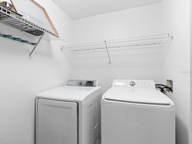 laundry area with washer and clothes dryer