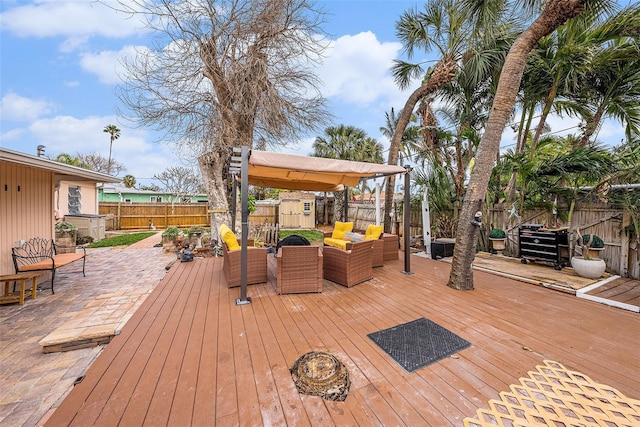 deck with an outdoor hangout area and a patio