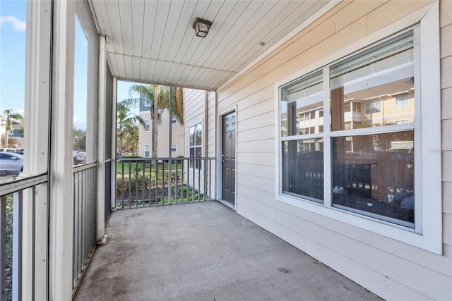 unfurnished sunroom with plenty of natural light