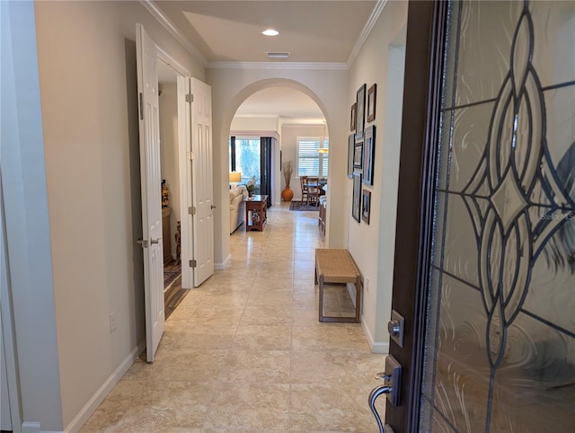 hallway featuring crown molding