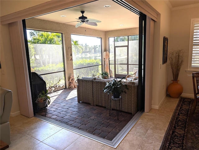 sunroom / solarium with ceiling fan