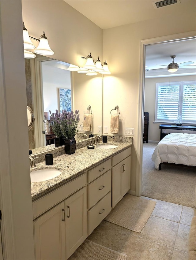 bathroom featuring ceiling fan and vanity