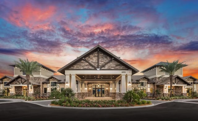 view of outdoor building at dusk