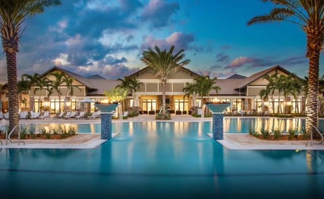 view of pool at dusk