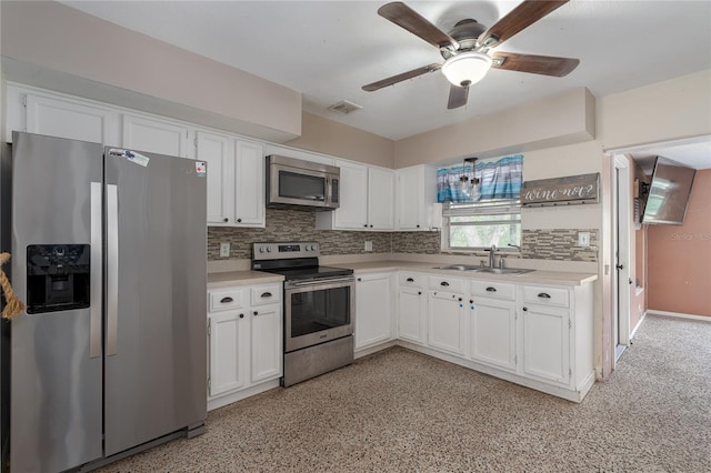 kitchen with white cabinetry, sink, and appliances with stainless steel finishes