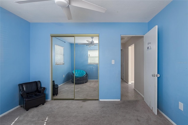 bedroom with ceiling fan and a closet