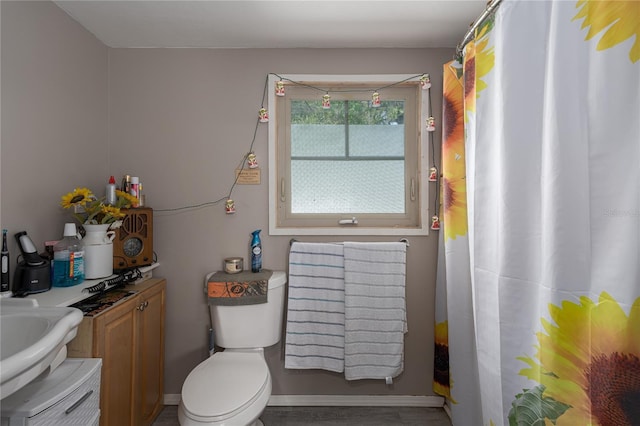 bathroom featuring toilet and sink