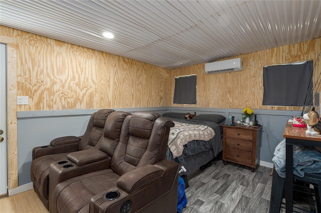 bedroom featuring an AC wall unit, wooden walls, and dark hardwood / wood-style flooring