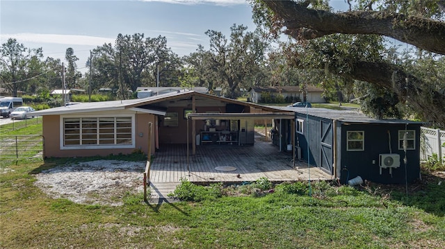 rear view of house featuring a carport