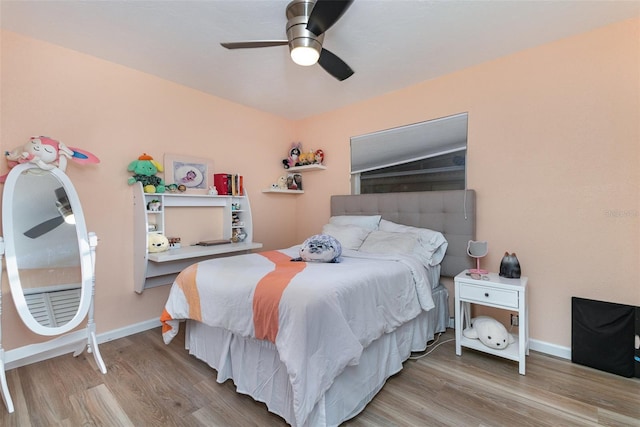 bedroom with hardwood / wood-style flooring and ceiling fan