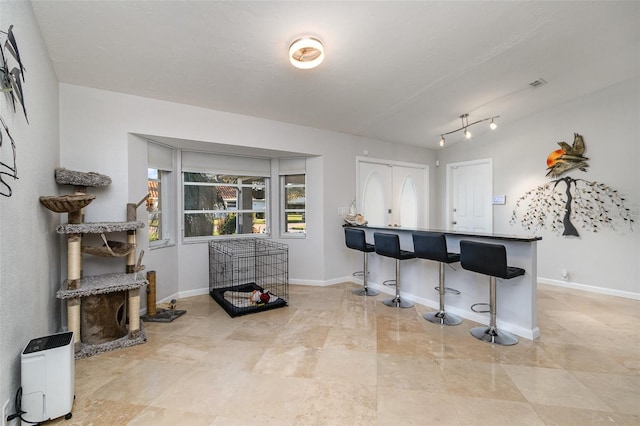 kitchen with a kitchen breakfast bar and french doors