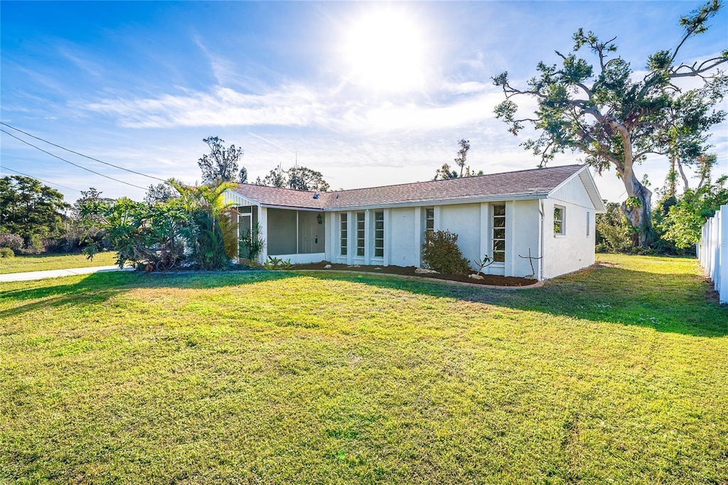 ranch-style home featuring a front yard