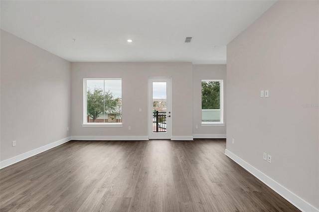 empty room featuring dark hardwood / wood-style floors