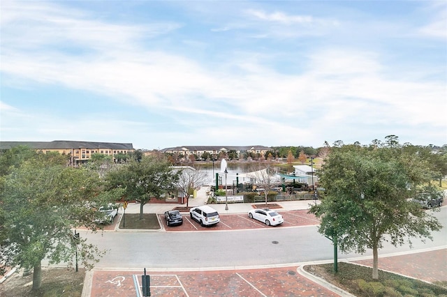 view of parking featuring a water view