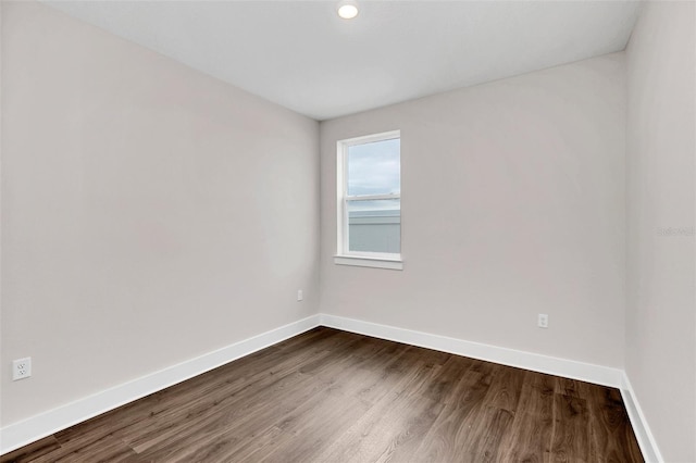 spare room featuring hardwood / wood-style flooring