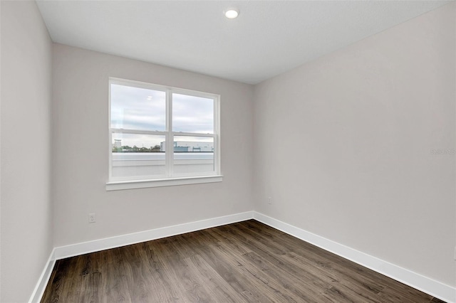 unfurnished room featuring hardwood / wood-style floors