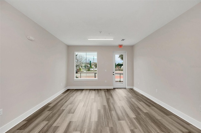 empty room featuring hardwood / wood-style flooring