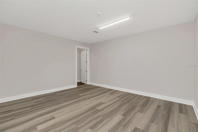 spare room with light hardwood / wood-style flooring