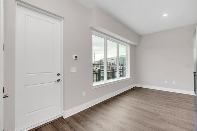 entryway with hardwood / wood-style floors