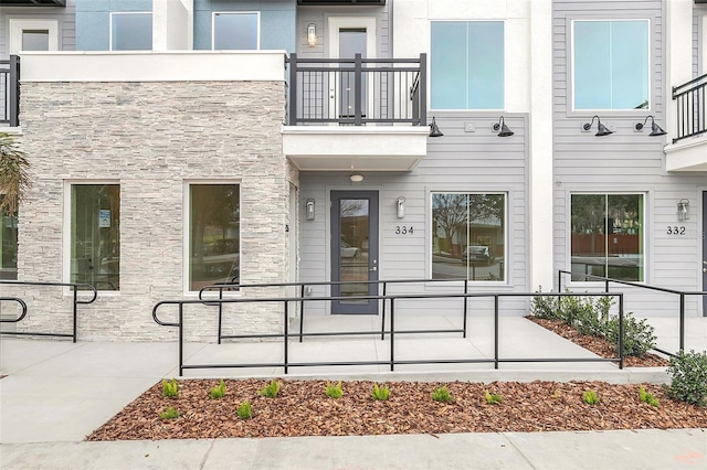 doorway to property featuring a balcony