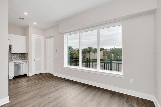 unfurnished dining area featuring light hardwood / wood-style floors