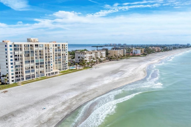 aerial view with a water view and a beach view