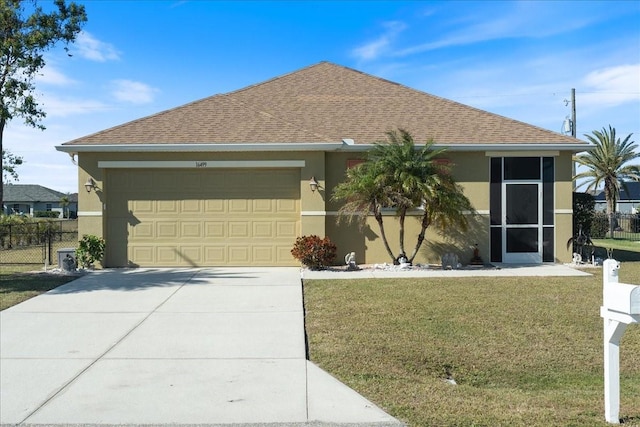 ranch-style house with a front yard and a garage