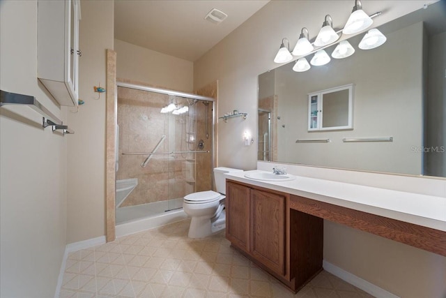 bathroom featuring a shower with door, vanity, and toilet