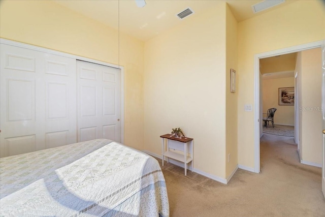 carpeted bedroom featuring a closet