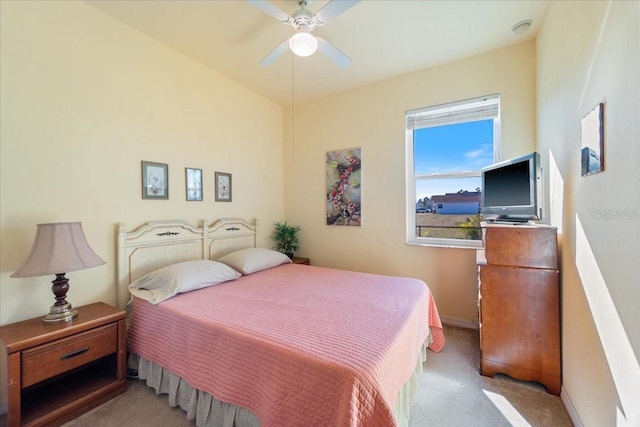 bedroom featuring ceiling fan and light colored carpet