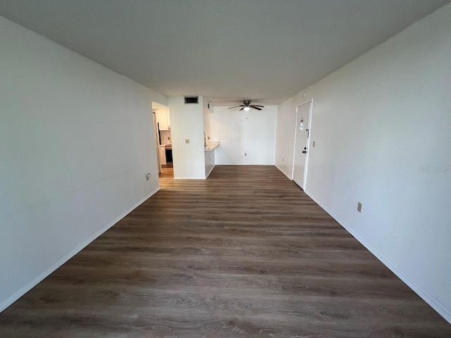 spare room featuring dark hardwood / wood-style floors and ceiling fan