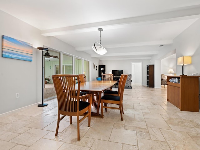 dining area featuring ceiling fan and beam ceiling