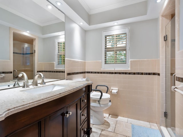 bathroom with vanity, tile walls, a wealth of natural light, and crown molding