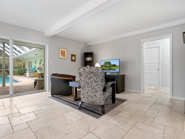 living room with beamed ceiling